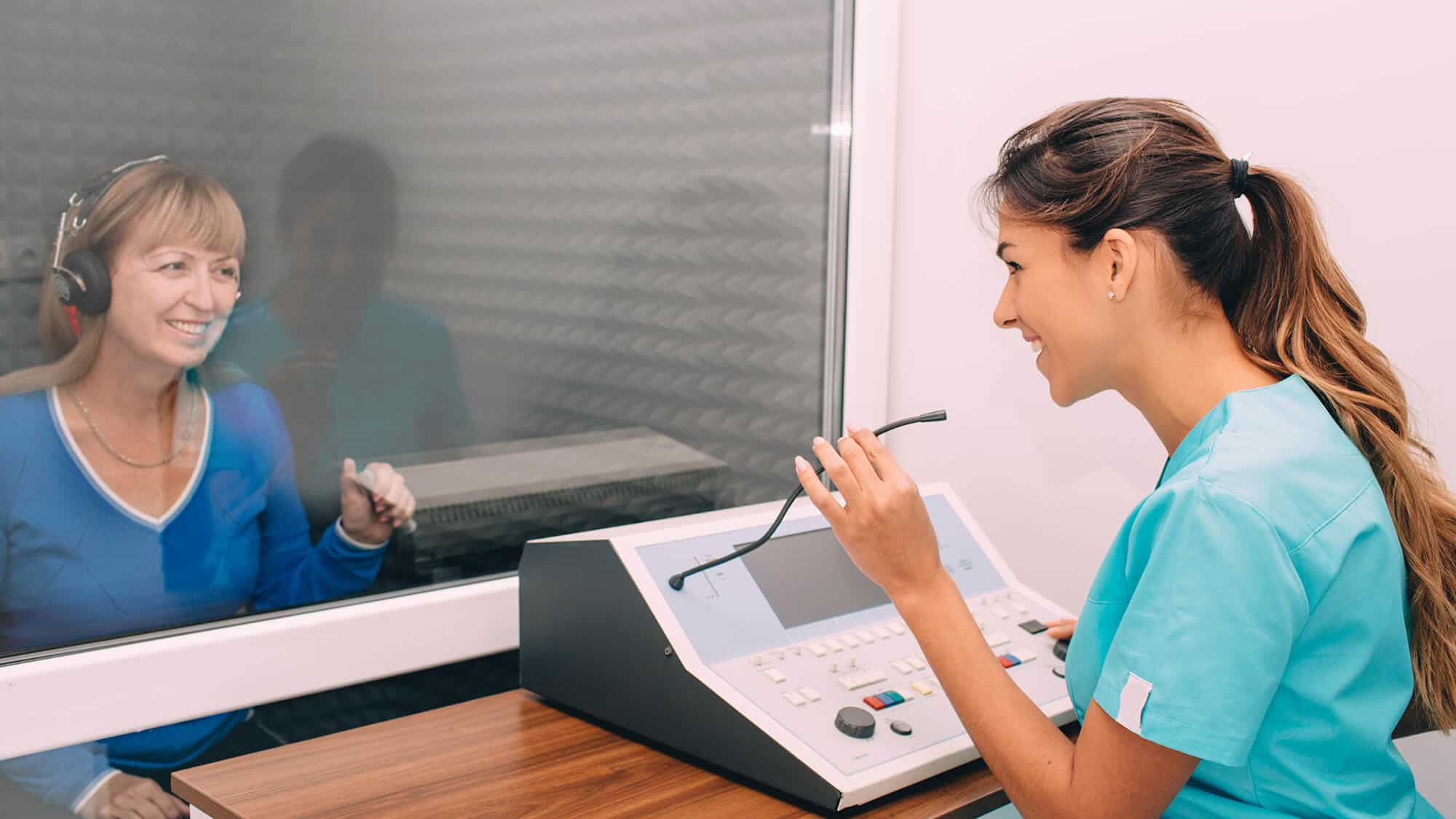 Audiologist Doing Hearing Exam