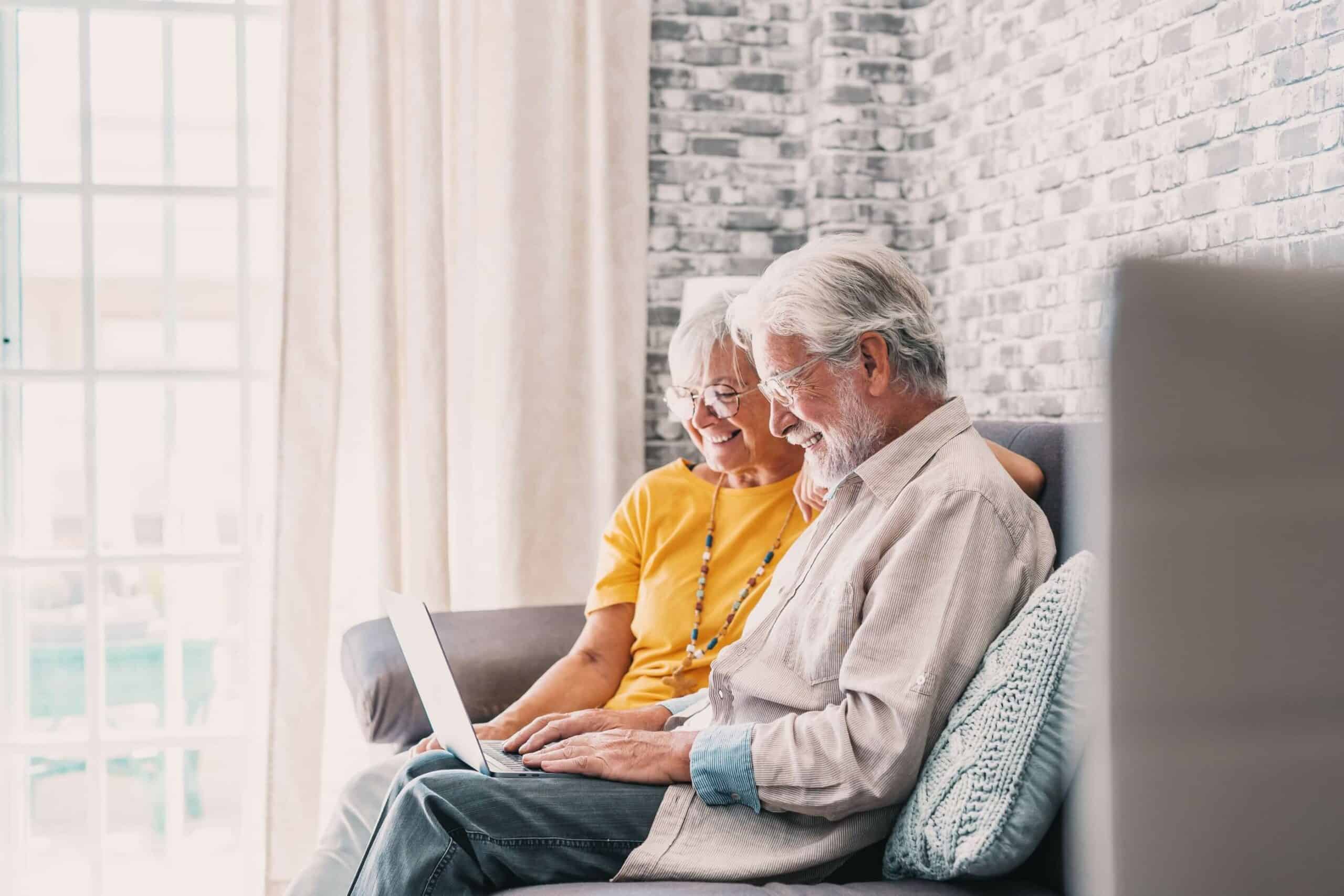 older couple sitting at computer together
